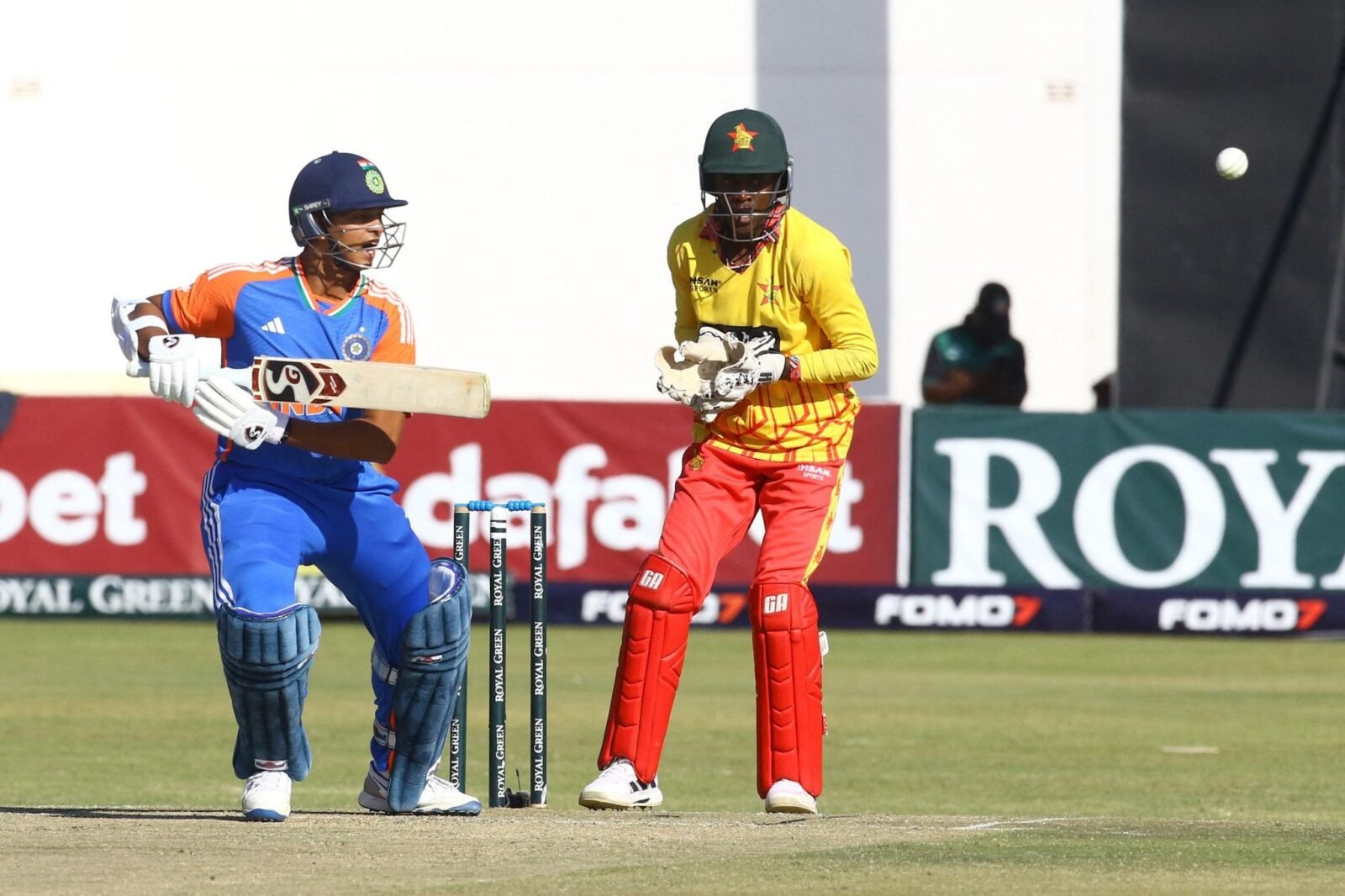 Indian cricketers celebrate during the opening T20I against Zimbabwe